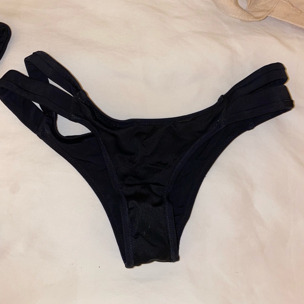 Black bathing suit bottoms with side cut out detail
